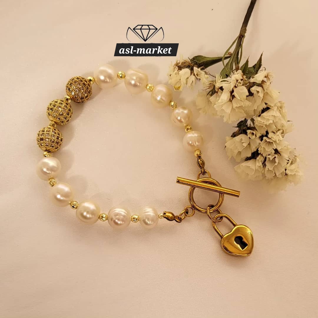 دستبند مروارید پرورشی گوی سواروسکی متریال استیل